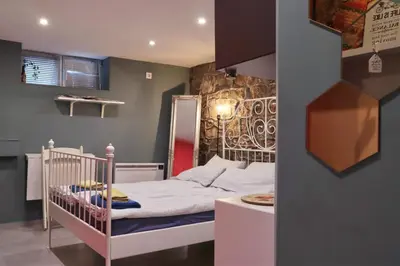 a small bedroom with a crib in a room at Sofia Center Cave in Sofia