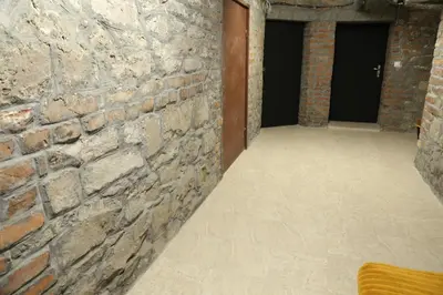 an empty room with a brick wall at Sofia Center Cave in Sofia