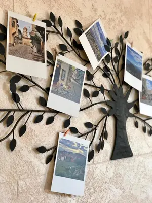a photo tree with pictures on top of it at Flamingo Plovdiv in Plovdiv