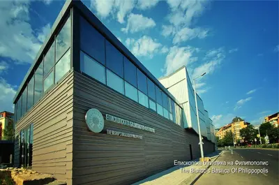a building with a clock on the side of it at Shahbazian House in Plovdiv
