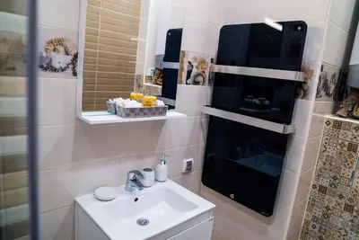 a bathroom with a sink and a mirror at Sofia Central Luxury Apartment in Sofia