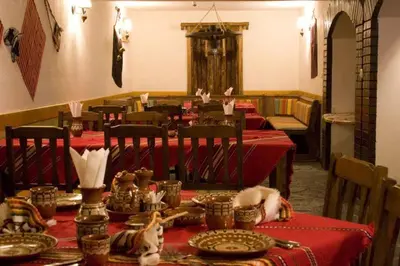 a dining room with tables with red table cloth at Pamporovo Hotel Snezhanka A425 in Pamporovo