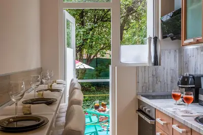 a kitchen with glasses of wine on a counter at Urban Garden in Sofia