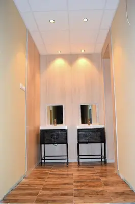 two sinks in a room with two mirrors at Bla Bla Hostel in Sofia