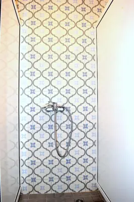 a mirror in a bathroom with blue and white tiles at Bla Bla Hostel in Sofia