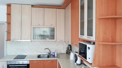 a kitchen with a sink and a microwave at Д и В 2 - D & V 2 Apartment in Sandanski