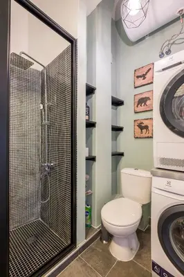 a bathroom with a toilet and a washing machine at blueWaveplace - Stylish 2 BR Home in Center of Sofia in Sofia