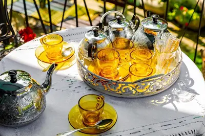 a tray of glasses and a tea pot on a table at Blacksmith's House - Old Town in Plovdiv