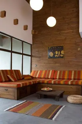 a living room with a couch and a table at The Reddoorshouse in Solishta