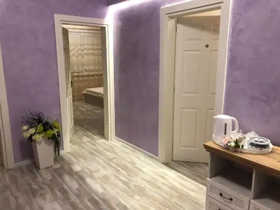a room with purple walls and a mirror at ФЛАМА РЕЗИДЕНТС in Plovdiv
