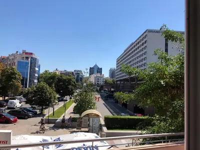 a view of a city street with tall buildings at ФЛАМА РЕЗИДЕНТС in Plovdiv