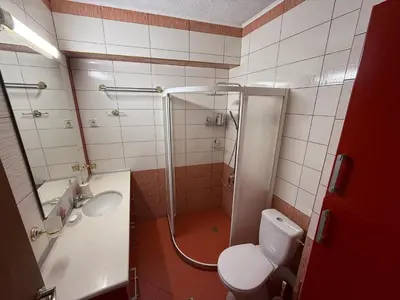 a bathroom with a shower and a toilet and a sink at Kamy-Sophia Apartment in Sofia