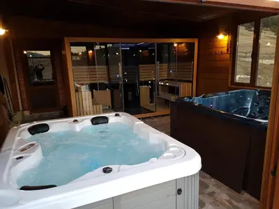 a jacuzzi tub in a room with at Къщи за гости БАШЕВИ in Sarnitsa