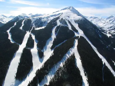an aerial view of a snow covered mountain at Cozy Apartment Next to Gondola in Bansko
