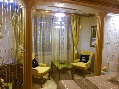 a bedroom with a bed and a table and chairs at Стаи за гости Топ Старс Смолян in Smolyan