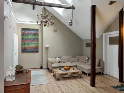 a living room with a couch and a table at Good Stay Sofia Apartments in Sofia