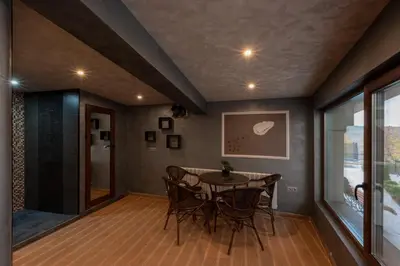 a dining room with a table and chairs at Къща за гости Пилигрим in Skrino