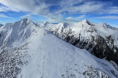 an aerial view of a snow covered mountain at Nice and quiet apartment next to Gondola lift. in Bansko
