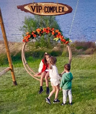 a group of three girls sitting in a circle with flowers at VIP Complex in Sarnitsa