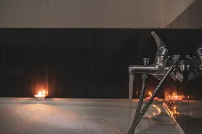 a water faucet in a room with a fire at Sky Garden House in Velingrad