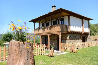 a house with a balcony on top of a tree stump at Dream house in Leshten