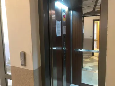 a elevator in a building with a sign on it at Rakovski Apartment GN / FREE GARAGE in Sofia
