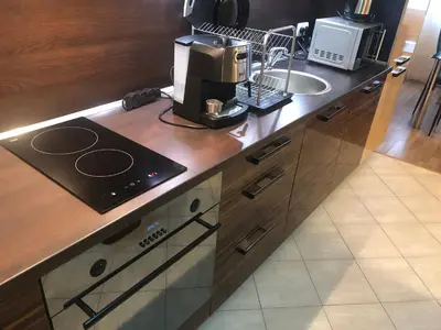 a kitchen counter with a coffee maker and a sink at Rakovski Apartment GN / FREE GARAGE in Sofia