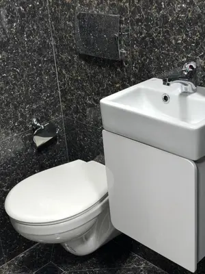 a bathroom with a white toilet and a sink at Cosy House in Sofia