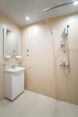 a bathroom with a sink and a shower at Апартамент АВА in Sandanski
