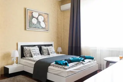 a bedroom with a bed and a window at Vitosha Blvd - 2BR LUX APART in Sofia