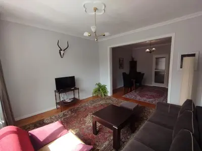 a living room with a couch and a table at Top Center Apartment 7 in Sofia