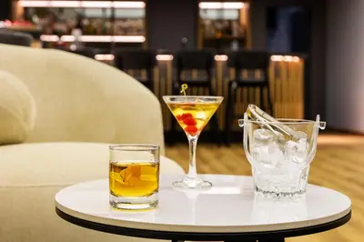 a tray with two drinks on a table at Kamengrad Hotel & SPA in Panagyurishte