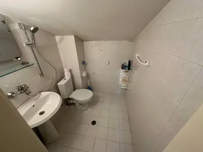 a small bathroom with a toilet and a sink at Cosy, quiet house with Vitosha view near Paradise in Sofia
