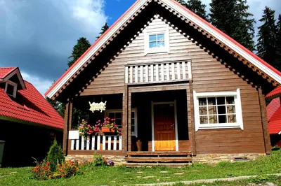 a small house with a red roof at Alpine ski chalet Borovets with sauna in Borovets