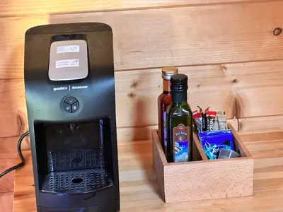 a drink maker with a bottle of wine at Alpine ski chalet Borovets with sauna in Borovets