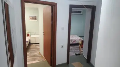 a hallway with a door leading to a bedroom at Modern and Old Base in Sofia