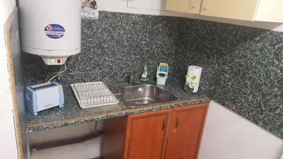 a kitchen counter with a sink and a mixer at Modern and Old Base in Sofia