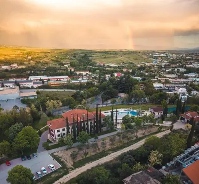 a view of a city with a rainbow in the sky at Villa Sintica in Sandanski