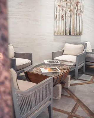 a room with chairs and a table with a coffee table at Villa Sintica in Sandanski