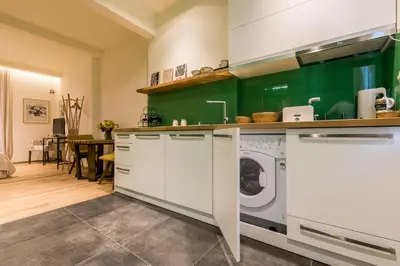 a kitchen with a washer and dryer at Este Apart - Top center in Sofia
