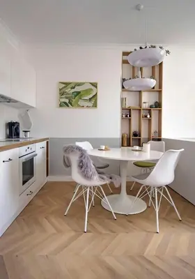 a kitchen with a table and chairs in a kitchen at Hip, Cosmopolitan Gem in the Heart of Sofia by Flat Mаnager in Sofia