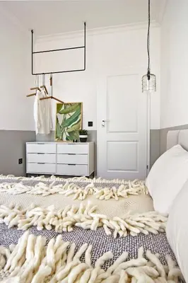 a bedroom with a bed with a rug on the floor at Hip, Cosmopolitan Gem in the Heart of Sofia by Flat Mаnager in Sofia