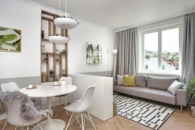 a living room with a table and a couch at Hip, Cosmopolitan Gem in the Heart of Sofia by Flat Mаnager in Sofia