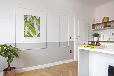 a kitchen with white cabinets and a plant on a counter at Hip, Cosmopolitan Gem in the Heart of Sofia by Flat Mаnager in Sofia