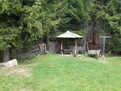 a garden with a gazebo and a fence at RELAX aпартаменти, Смолянски езера, вила ВЕНЕРА, к-с Маунтин Лейк in Smolyan