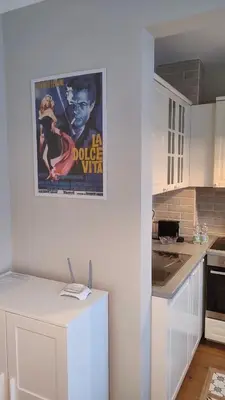 a poster of a movie on the wall of a kitchen at Dolce Vita-Sofia Apartment in Sofia