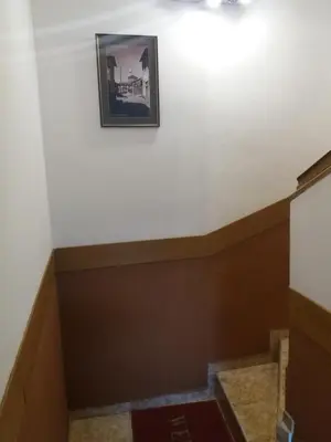 a stairwell in a room with a picture on the wall at Comfort Guest House in Samokov
