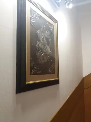 a painting hanging on a wall in a room at Comfort Guest House in Samokov