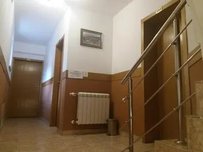a hallway with a staircase and a door and a hallway at Comfort Guest House in Samokov
