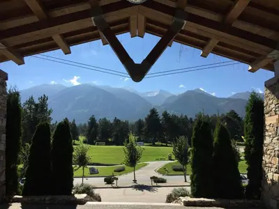 a view of a park with mountains in the background at ★ Chic & Elegant 1 Bedroom in Eagle's Nest Complex ★ Close to Gondola and Bar Street in Bansko